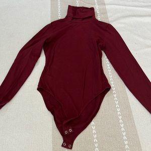 American apparel turtle neck body suit in burgundy size small